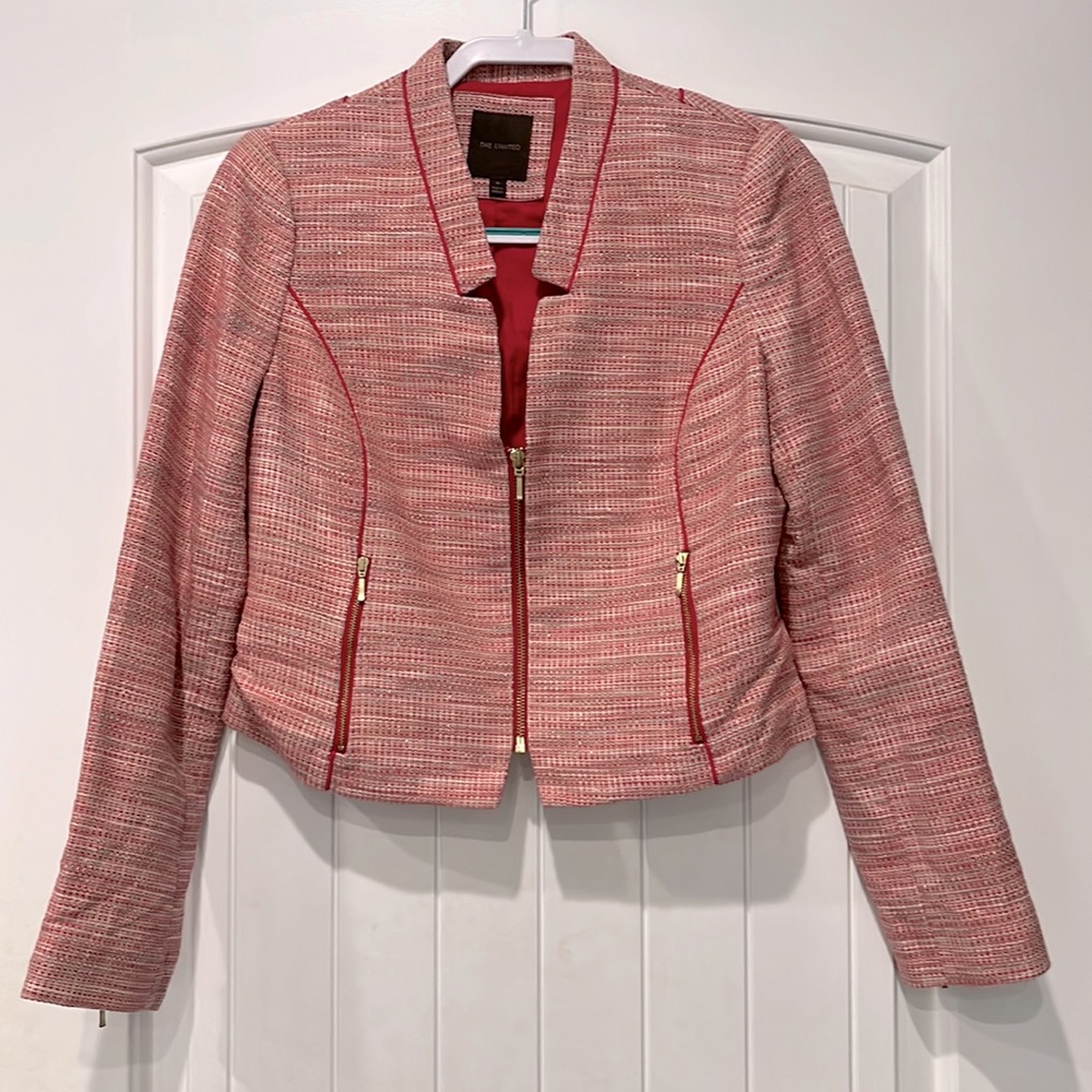 The limited blazer size medium. Gold zipper. Pink, white and silver